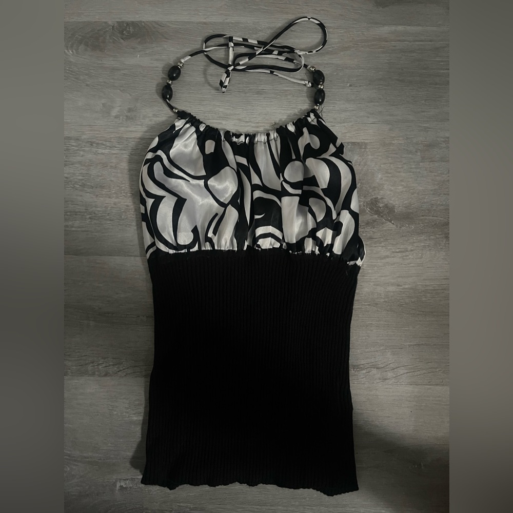 Beautiful halter with geometric details, beading and lettuce trim.